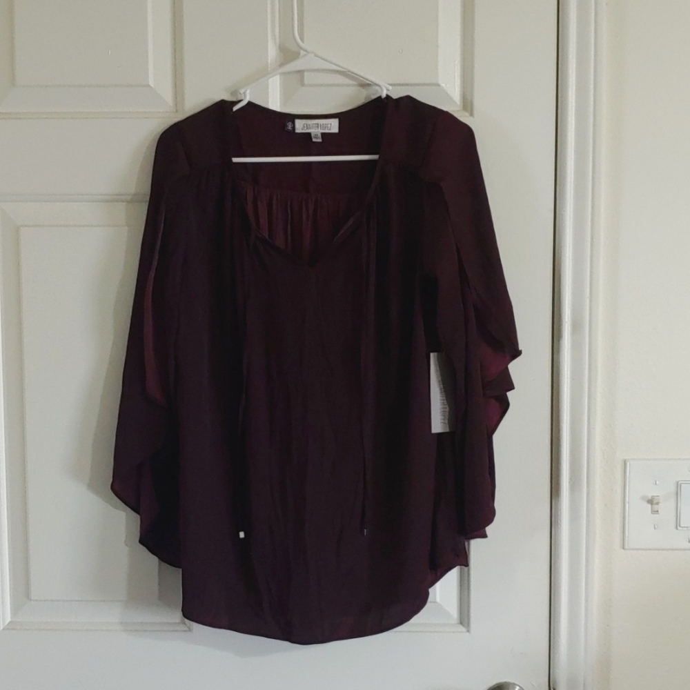 Jennifer Lopez Maroon Purple top.